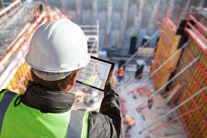 engineer architect construction worker on construction site with tablet computer engineer on construction site with tablet