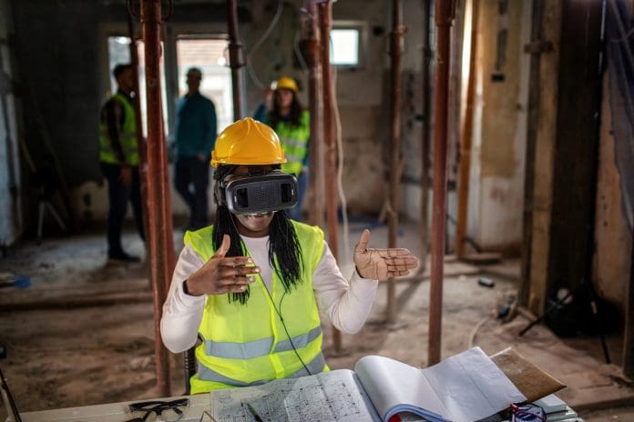 Construction site worker using VR glasses Construction site worker using VR glasses