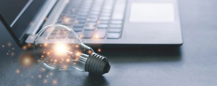 Laptop and glowing light bulb. Self learning or education knowledge and business studying concept. Idea of learning online or e-learning from home. Online learning
