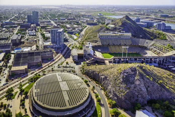 ASU campus Tempe AZ Sun Devil Football Stadium aerial view Skyline panoramic aerial helicopter view of Tempe, Arizona. Showing ASU Arizona State University campus with Sun Devil Football Stadium (Frank Kush Field) on middle right and Wells Fargo Arena in bottom left foreground. "Tempe Town Lake" - Salt River in background.