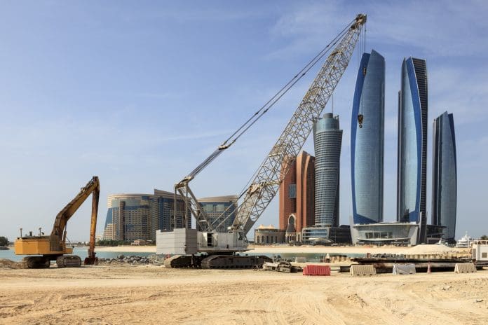 Construction site in Abu Dhabi, UAE Crane at a construction site in Abu Dhabi, United Arab Emirates