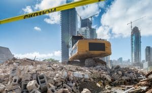 Heavy machinery clearing construction waste to make way for a new housing development site in Miami.