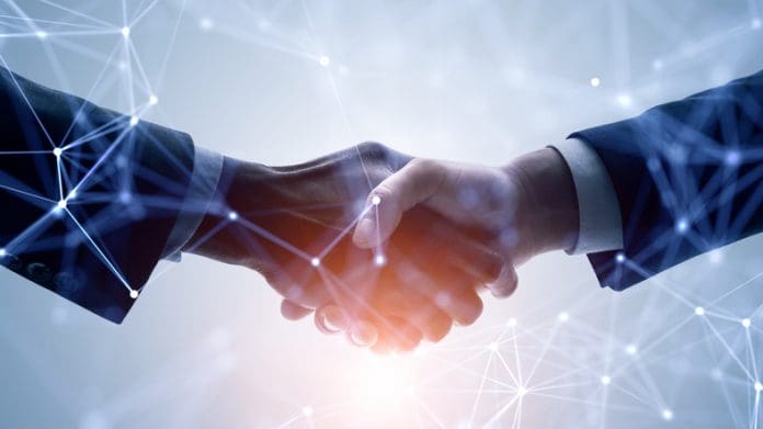 Business network concept. Customer support. Shaking hands. Close up of two hands in a handshake overlaid with point cloud image. NV5 Global acquires BIM, reality capture and digital twin specialist myBIMteam