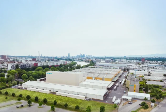 98a5119b-495e-4397-9695-171eee317bd0-high An aerial shot of the Siemens Smart Infrastructure switchgear plant in Frankfurt, Germany.