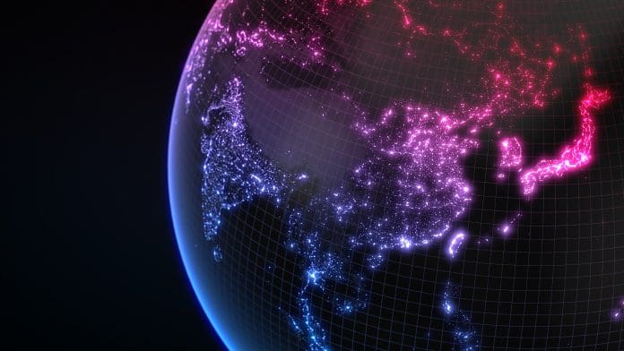 dark earth globe with glowing details of city and human population density areas. 3d illustration Indian and Chinese businesses ‘racing ahead of UK, Japan and Netherlands in AI adoption’