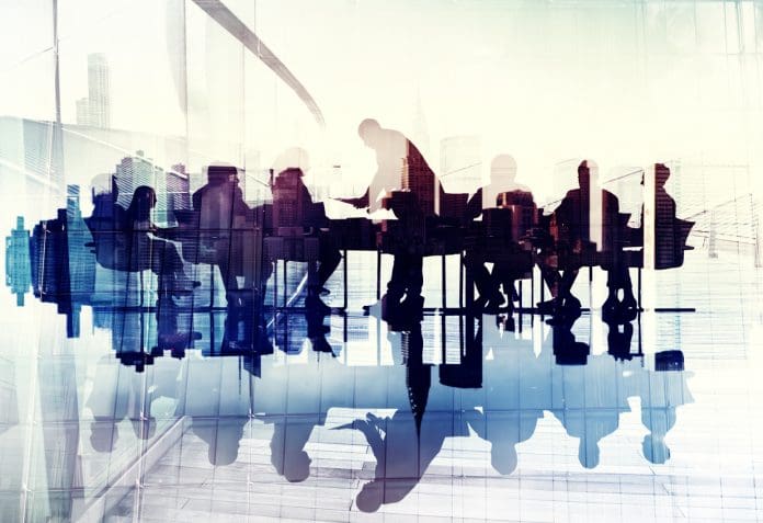 Abstract Image of Business People's Silhouettes in a Meeting “Superhuman” AI assistant launched to streamline construction meeting
