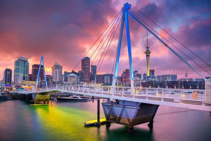Auckland. Auckland, New Zealand at sunrise. New Zealand has unveiled a plan to make the country a world leader in responsible AI across key sectors, including architecture, engineering and construction, by 2030