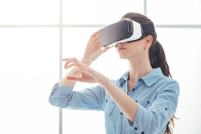 Woman using a VR headset Woman using a VR headset. Resolve App Portal launched to boost construction VR reviews