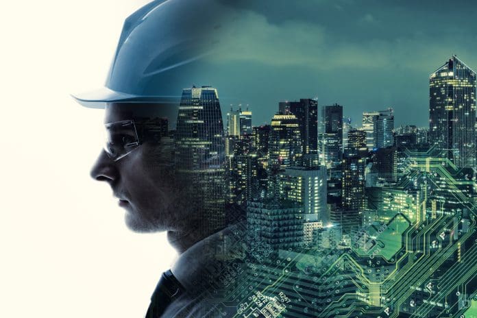 Industrial technology concept. INDUSTRY4.0 A profile of a person wearing a hard hat merges with a cityscape and digital circuit design, symbolizing urban development and the integration of technology through digital twins.