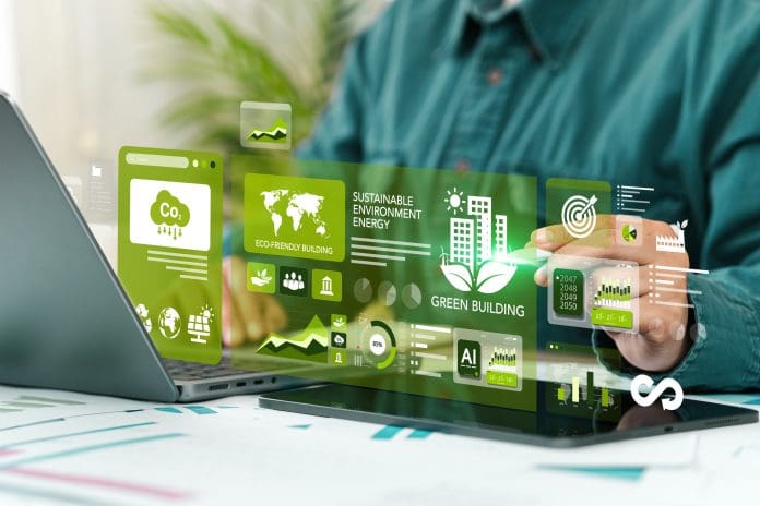 Sustainable Green Building Concept. Eco-friendly Building. Businessman Using Computer Displaying Digital Screen. Future Green Business. Environmental Sustainability Goals 2050. Sustainable Green Building Concept. Eco-friendly Building. Businessman Using Computer Displaying Digital Screen. Future Green Business. Environmental Sustainability Goals 2050.